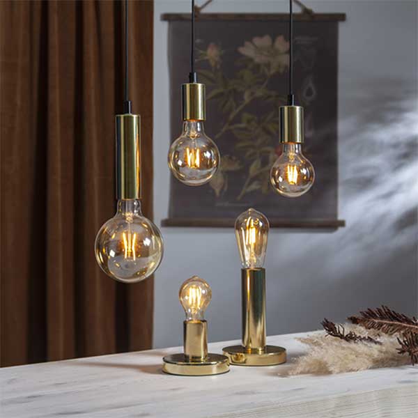 Combine modern day technology with classic looks using this round golden dimmable filament E27 Edison screw bulb. Set this smart LED bulb to warm white light colour for comfortable and cosy relaxing atmosphere. Mix technology with classic style using the LED dimmable filament E27 bulb. Create your own cosy home atmosphere warm light setting of the E27 Edison screw bulb. The vintage style golden ST64 shaped E27 Edison screw bulb with warm white colour fits table and floor lamps with classic and modern home interior. EASY TO CONTROL: Change the brightness the dimmable filament LED bulb remotely – via your smartphone or tablet, using free ENERJSMART App for Android or iOS without any subscription. You don't need a separate hub, since the smart LED light bulb connects directly to your Wi-Fi router. The E27 LED bulb supports voice control – via Amazon Alexa or Google Home. You don't need to stand up from your comfortable sofa to turn the light off, just relax! PROGRAM AND COMBINE: Even if you forget to turn off the light, don't come back! Schedule your dimmable filament E27 LED bulb to go off at 9 am or to switch on at 7 pm or as the TV goes off. BRIGHT AND LONG LASTING: The E27 LED bulb is made for general lighting. 806 lm of the dimmable LED bulb provide as much light as traditional 40W bulb, and last for 2 years if the light is on all the time. The filament E27 LED bulb consumes only 8.5W, when lights are on. Save hundreds of Euro per year with the eco-friendly and energy saving E27 bulb