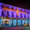 Giant red bow 2D Christmas decoration on Longford arms hotel building